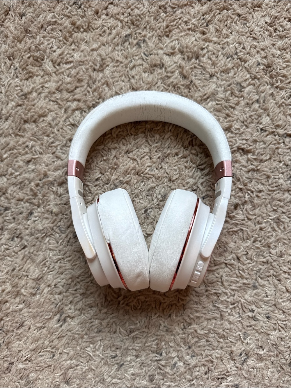 Raycon white/rose gold headphones